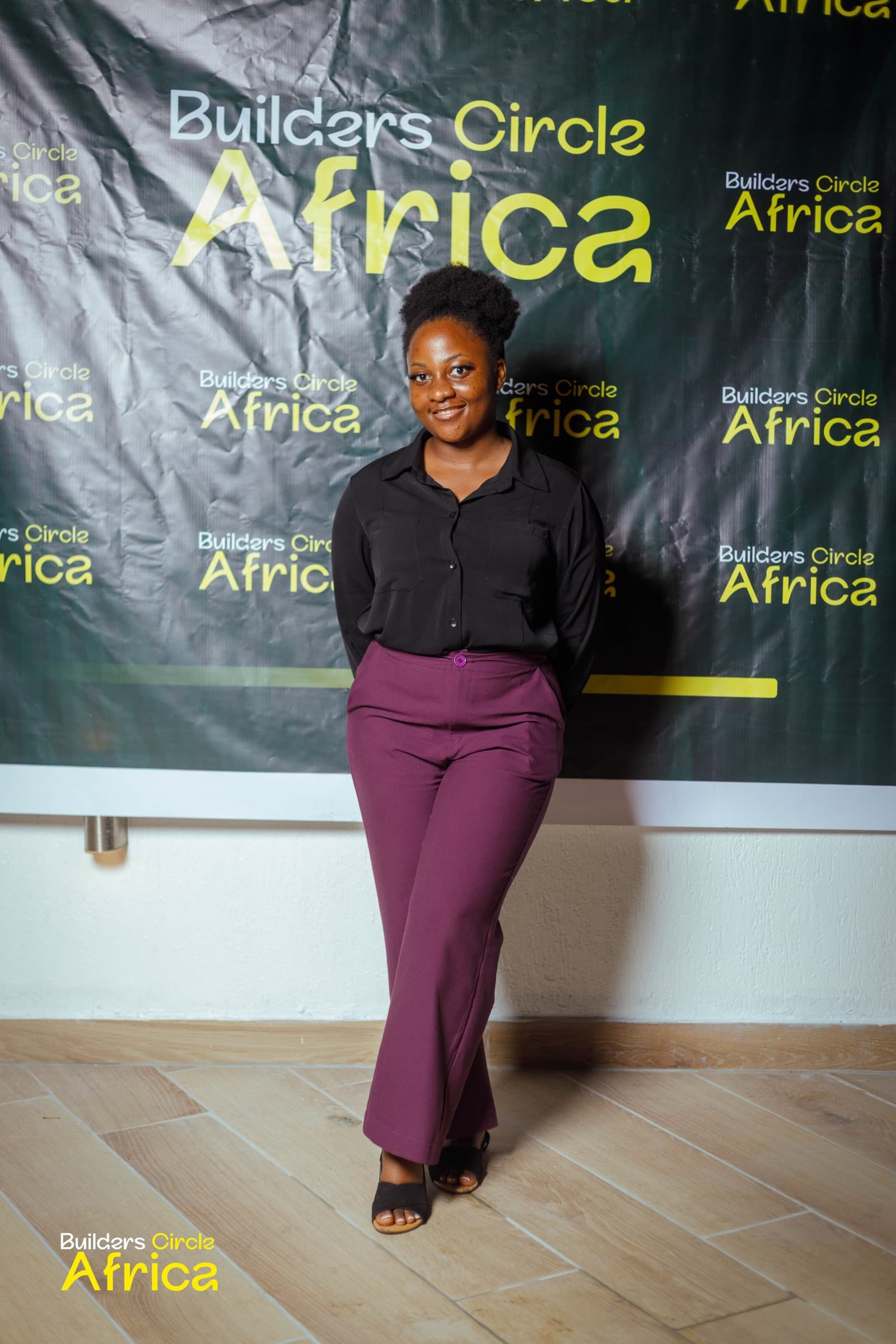 A guest in front of the Builders Circle Africa banner