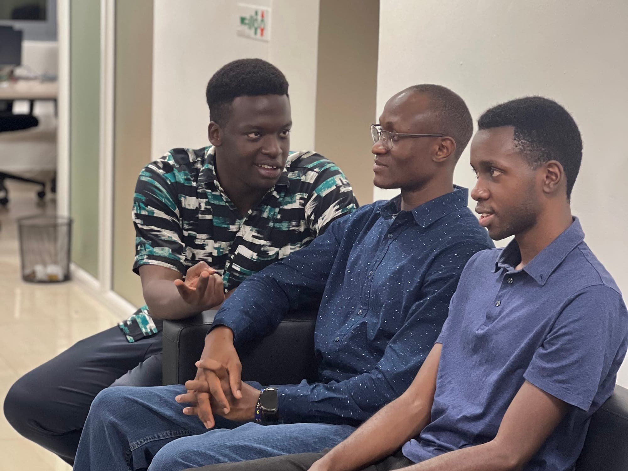 Three members talking at the Kampala launch